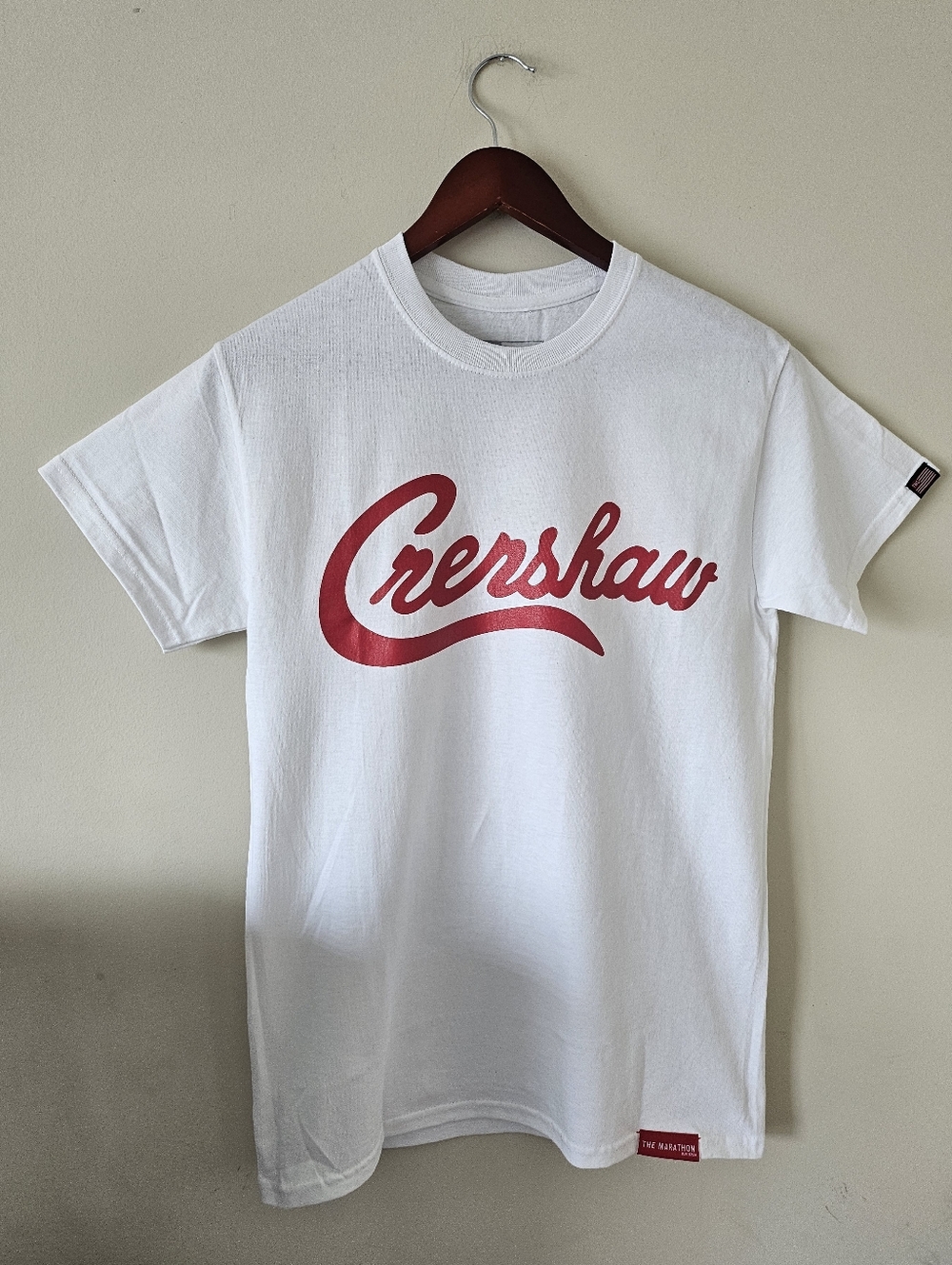 The Marathon Clothing White T‑Shirt with Red "Crenshaw" Script